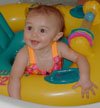 Genevieve swimming in Grandma's bath tub